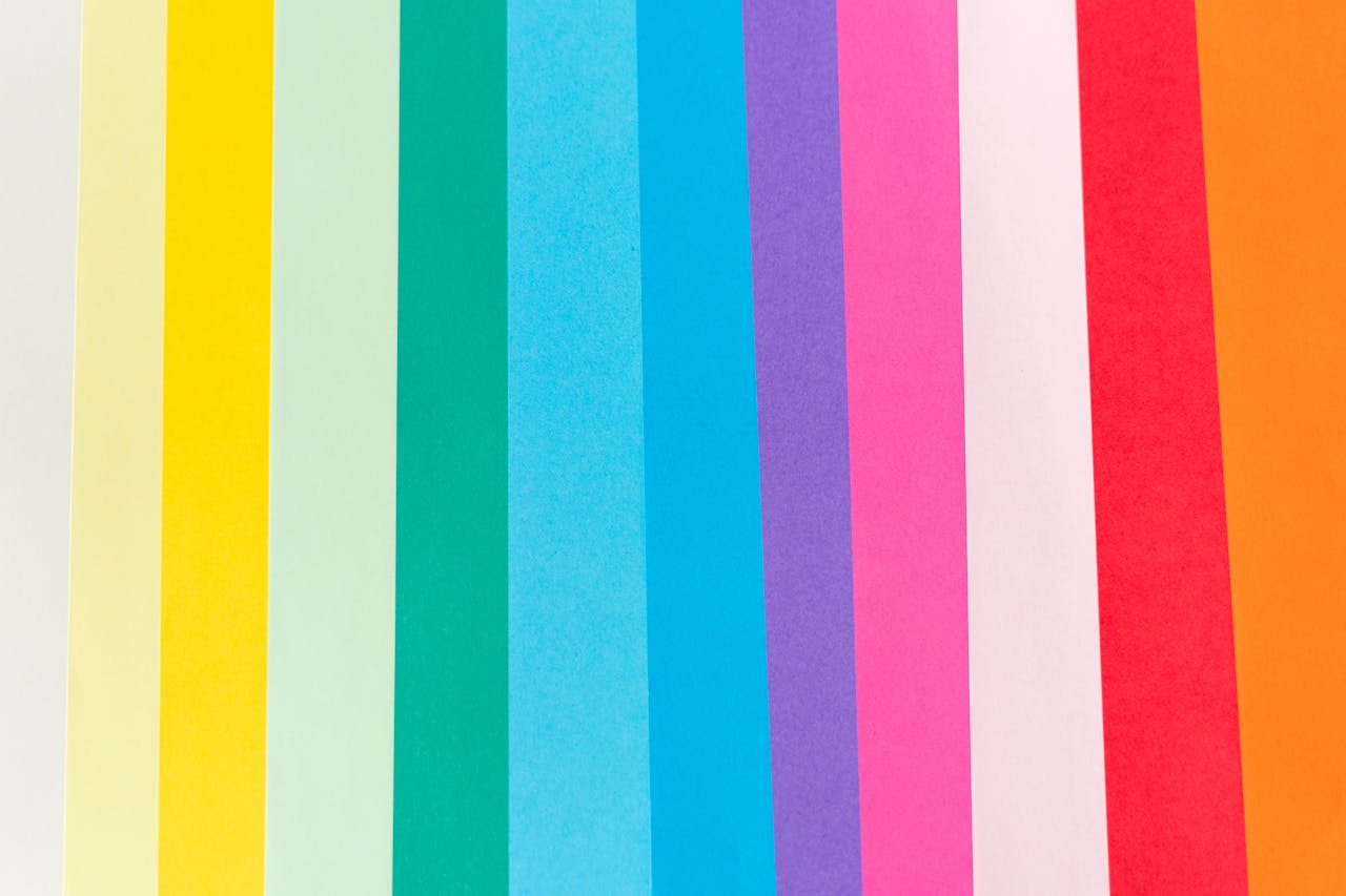 Top view of palette of vibrant colorful lines with different shades in row forming abstract background